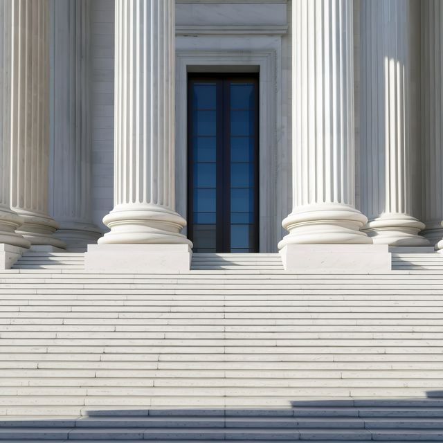 Photo: Stone columns and wide steps in front of a government building